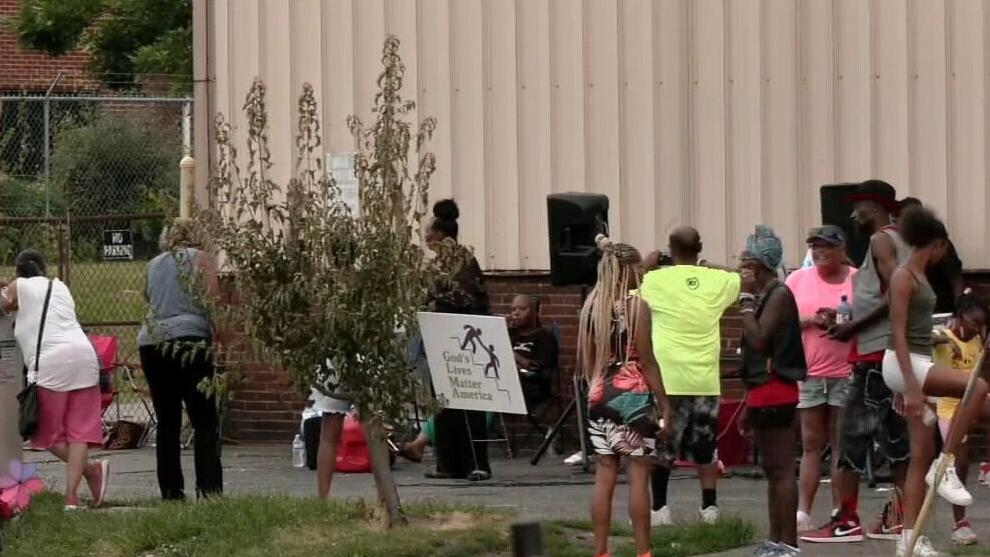 One week later, dozens of people gather to hold a vigil in West Louisville for the H2O Lounge victims
